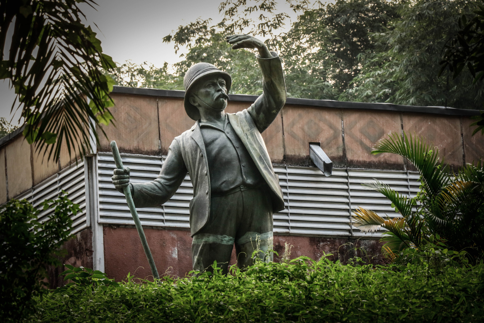 A statue of Henry Morton Stanley by Belgian sculptor Arthur Dupagne at the Institute of National Museums of Congo, in the Mont Ngaliema area of the capital Kinshasa last week. Welsh-born explorer and journalist Stanley was employed in 1879 by the crown prince of Belgium, Leopold II, to annex Congo on his behalf. The Stanley statue was first erected in 1956 near this location where he built his first post, but was taken down in 1971, cut off at the feet and left lying face up behind the building. It has recently been remounted as part of the museum grounds. © Justin Makangara for Fondation Carmignac. Kinshasa, Democratic Republic of Congo, June 2020