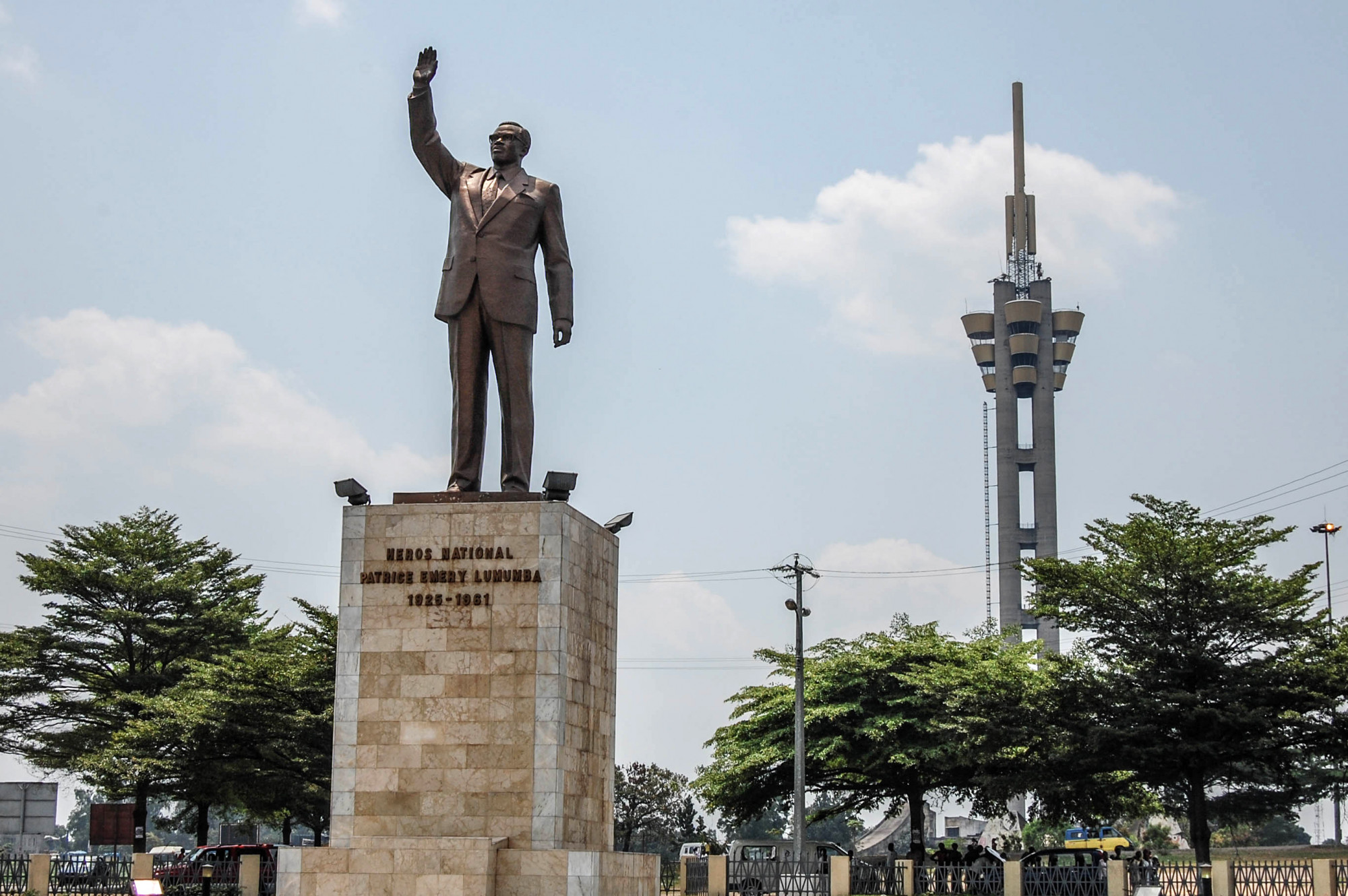 Kinshasa, Democratic Republic of Congo, 2010. The Tower of Limete, a 200-meter tall monument to Congolese independence leader Patrice Lumumba, and a statue of Lumumba, were erected in 1974 along the Lumumba Boulevard linking Kinshasa’s airport to the city center. © From the personal archives of Justin Makangara for Fondation Carmignac