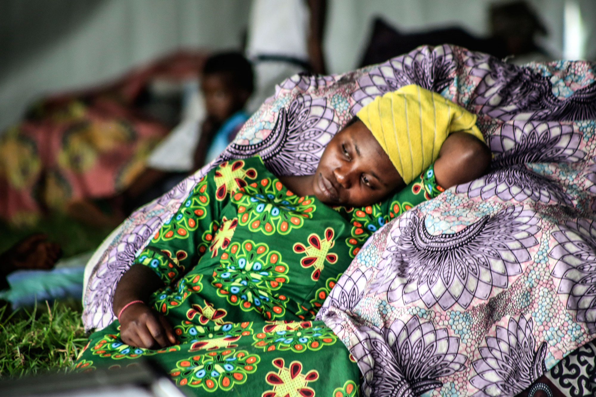 Rugero, Rwanda, May 2021. Bahati, who fled across the border into Rwanda, rests at a centre for people displaced by the eruption, in Rugero, Rwanda. © Ley Uwera for Fondation Carmignac 