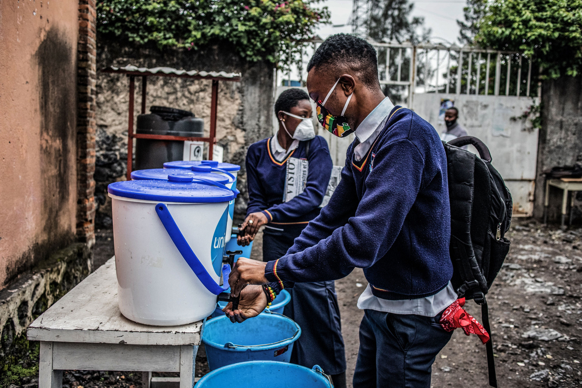 Goma, DRC, February 2021. Students wash their hands at the entrance to Mwanga Institute. © Moses Sawasawa for Fondation Carmignac