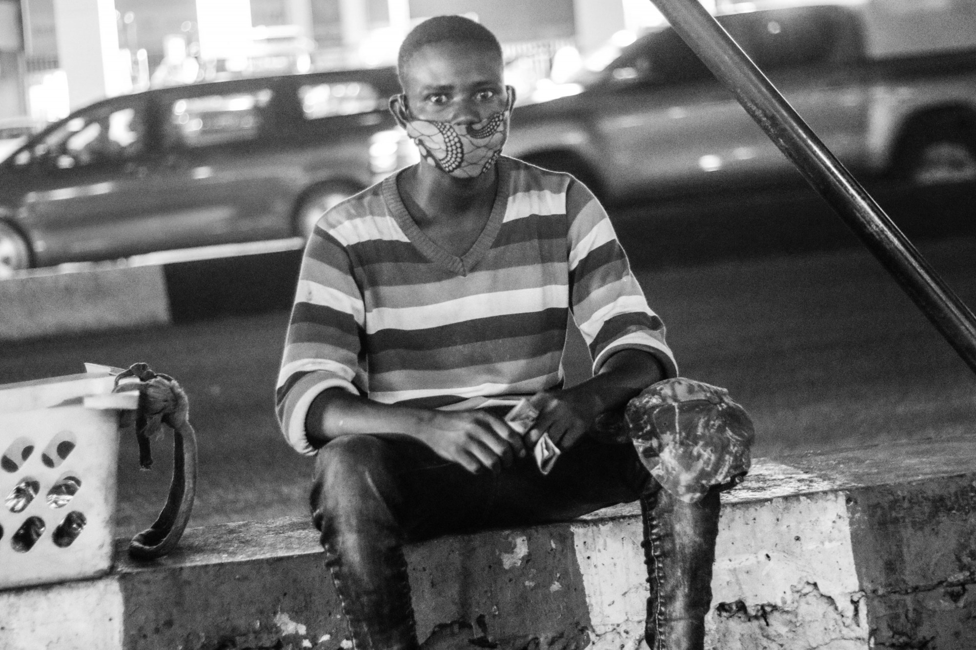 Fabrice, a street vendor and a resident of the disadvantaged Camp Luka neighbourhood of Kinshasa, said that he cannot afford a disposable mask and instead washes his cloth mask each night for use the next day. © Justin Makangara for Fondation Carmignac
